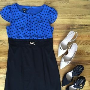 Fun knee-length two-fer dress with flutter sleeve!